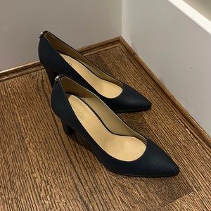 Brand new never been work navy blue Michael Kors pumps. 3 inch heel.